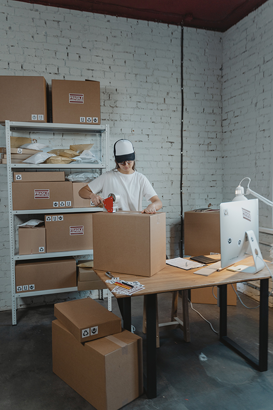 person-packing-and-shipping-boxes